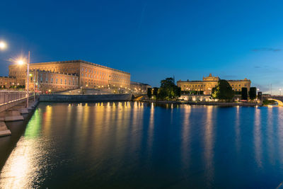 Illuminated city at waterfront