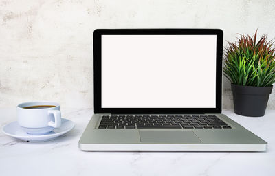 Close-up of laptop on table