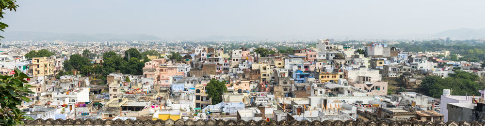 High angle view of buildings in city against clear sky