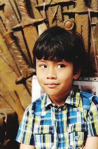 Portrait of cute boy standing outdoors