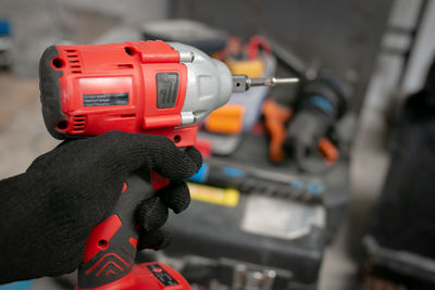 Cropped hand of man working at workshop