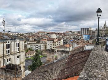 High angle view of buildings in city against sky