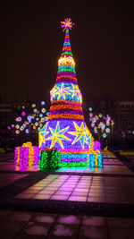 Illuminated christmas tree at night