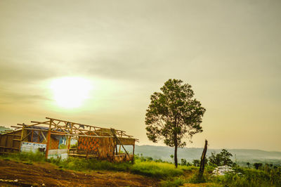 Built structure on landscape against sky