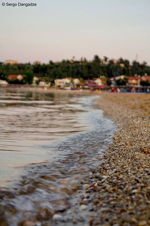 SCENIC VIEW OF BEACH AGAINST SKY DURING SUNSET