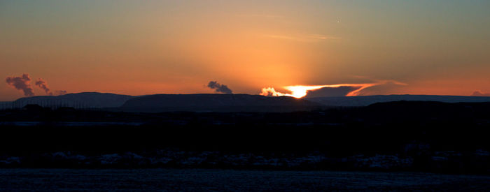 Scenic view of mountains at sunset