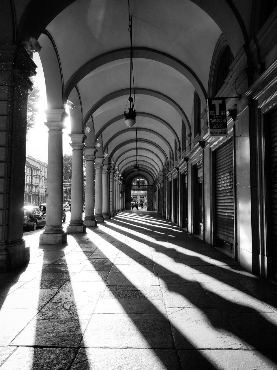 VIEW OF CORRIDOR OF BUILDING WITH COLONNADE