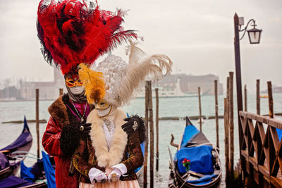 People in traditional clothing against sky