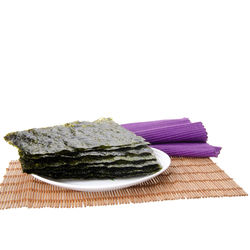 Close-up of cake on table against white background