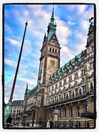 Low angle view of clock tower against sky