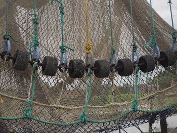 View of fishing net hanging on fence