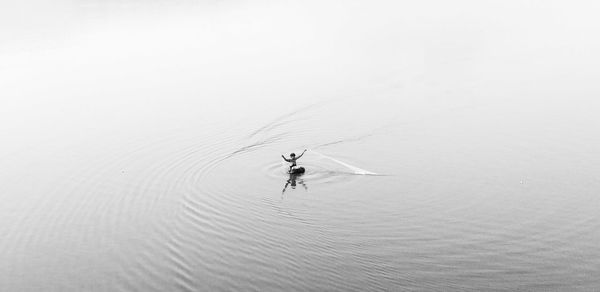 High angle view of fisherman fishing in river