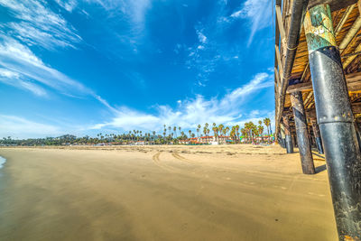 Panoramic view of beach against blue sky