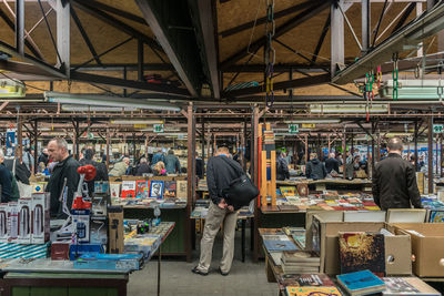 Group of people at market stall