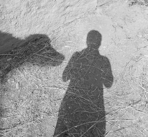 Shadow of man on field