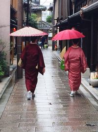 Rear view of woman walking in city