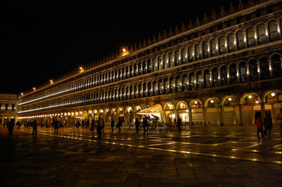 Illuminated palace at st marks square in city during night
