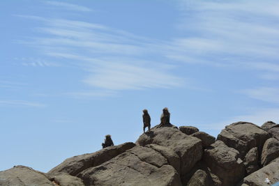 Low angle view of rock against sky