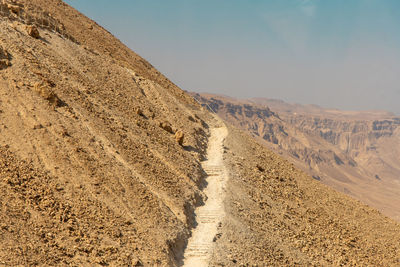 Scenic view of arid landscape against clear sky