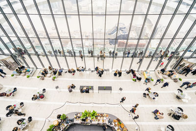 High angle view of people walking in modern building