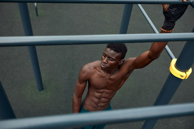 High angle view of muscular man standing outdoors