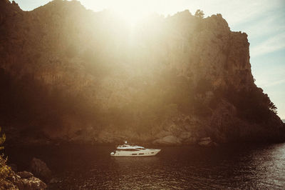 Sailboat sailing on sea against sky