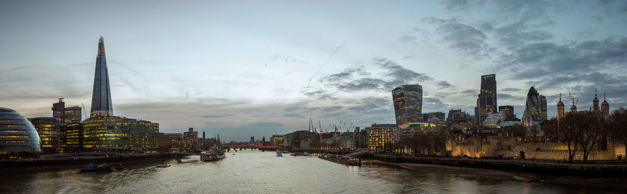 River amidst buildings against sky