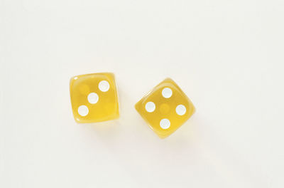 Close-up of coins over white background