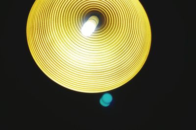 Low angle view of illuminated light bulb