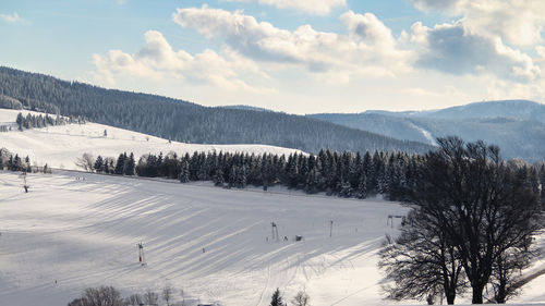 Scenic view of snowcapped mountains against sky