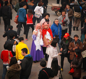 High angle view of people standing at night