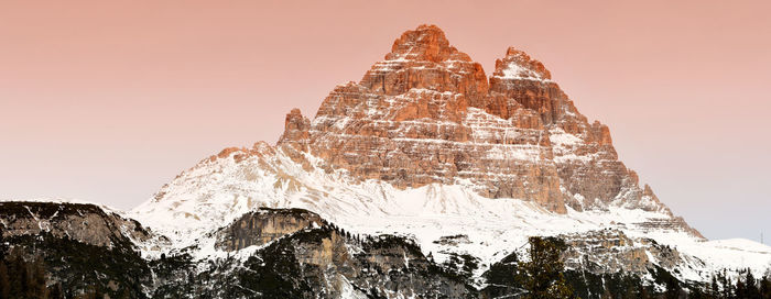 View of rock formation against sky during winter