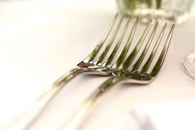 Close-up of metal container on table