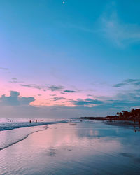 Scenic view of sea against romantic sky at sunset