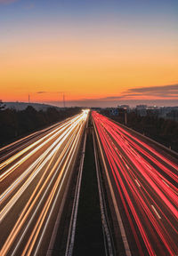 High angle view of light trails on highway at night