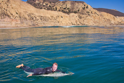 Portrait of man swimming in sea