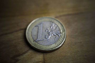 Close-up of coins on table