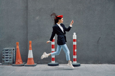 High angle view of woman standing against wall