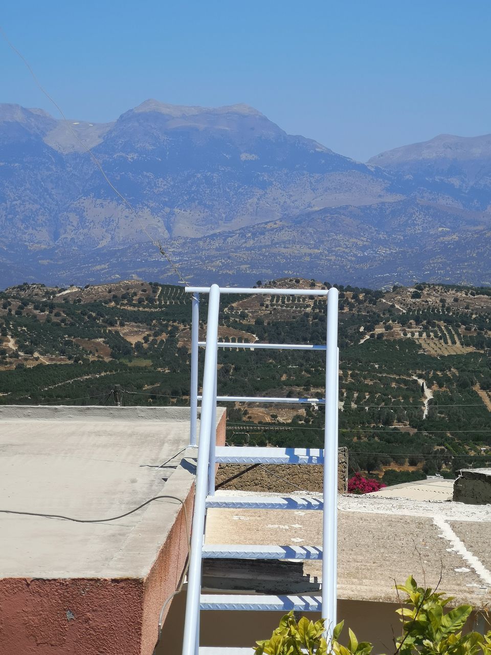 SCENIC VIEW OF MOUNTAINS AGAINST BLUE SKY