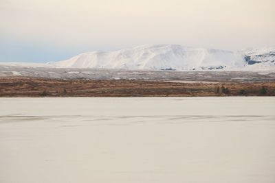 Scenic view of snowcapped mountains against sky