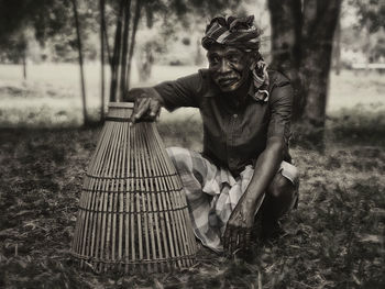 Man sitting on tree trunk