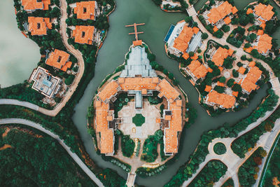 High angle view of cross amidst buildings in city