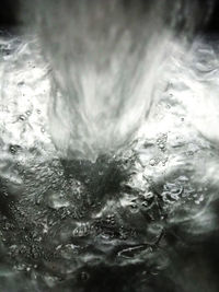 Full frame shot of water pouring in drinking glass