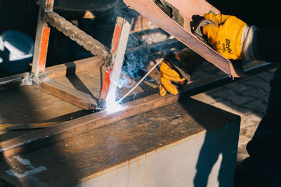 Worker welding metal