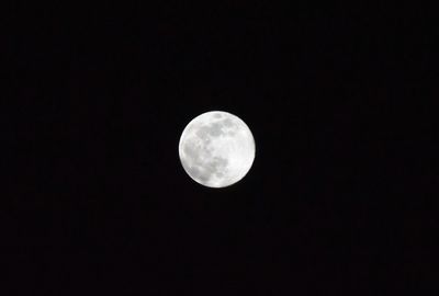 Low angle view of full moon in sky