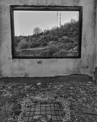 Abandoned building seen through window