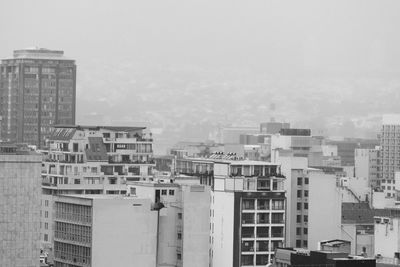 High angle view of buildings in city against sky