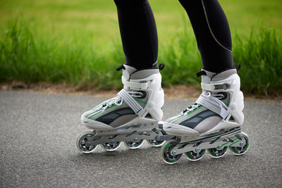 Low section of man standing on skateboard