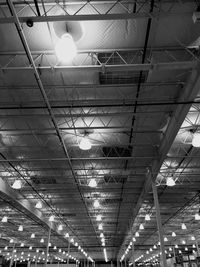 Low angle view of illuminated light bulbs in ceiling