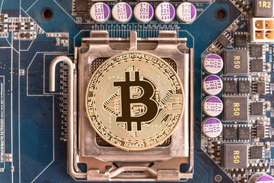 Close-up of bitcoin on circuit board